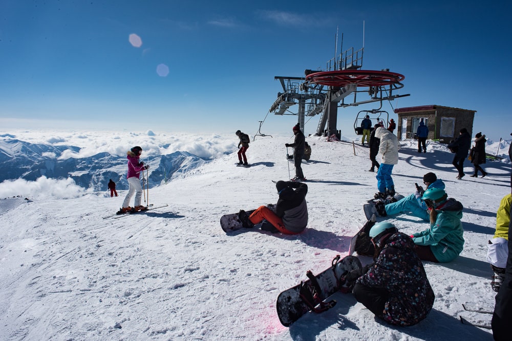 Snowboarders and skiiers near the top of the Gudauri resort, which is Georgia's largest.